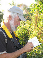 birdwatcher taking notes